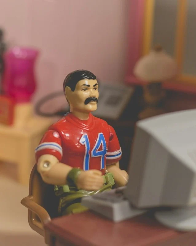 Collectible Figure Desk Scene — style reference photo